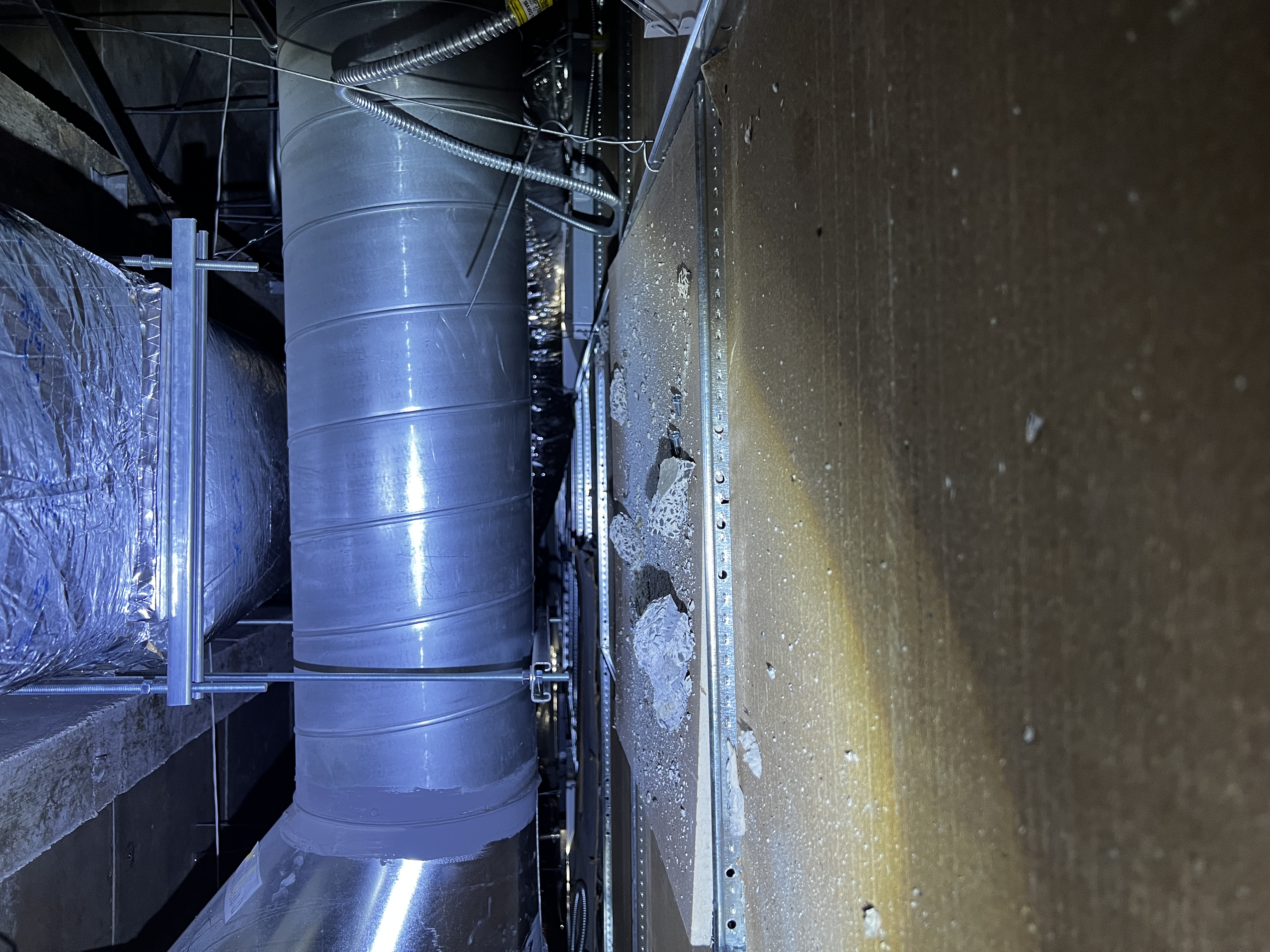 Picture above the ceiling of ductwork for a laboratory.